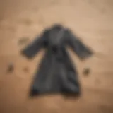 Stylish beach changing robe laid out on sand