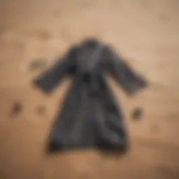 Stylish beach changing robe laid out on sand