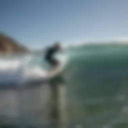 A surfer riding a majestic wave at Malibu
