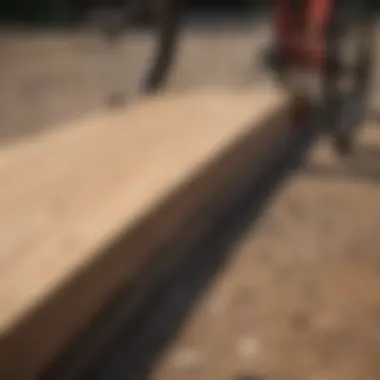 A close-up view of materials used in constructing mountain bike ramps, including wood and metal components.