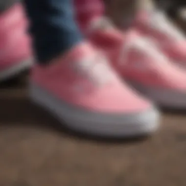 Close-up of pink Vans sneakers surrounded by extreme sports gear