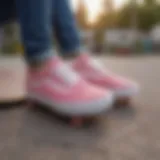 A pair of pink Vans sneakers on a skateboarding ramp