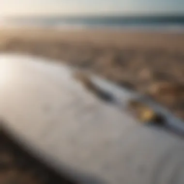 Close-up of a surfboard with maintenance tools nearby