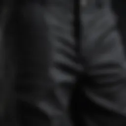 A close-up view of the durable fabric of Dickies carpenter pants in black