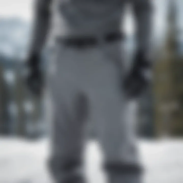 Stylish grey snowboard pants on a snowy slope