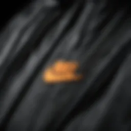 A close-up of Nike zipper jacket fabric showcasing breathability and flexibility