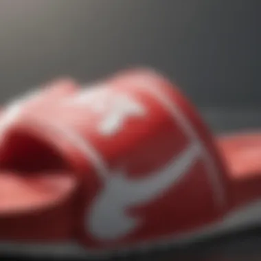 Close-up of the material quality of red and white Nike slides