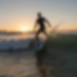 Surfer riding a wave at Wrightsville Beach during sunset