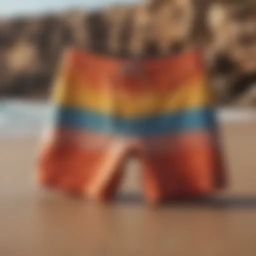 Vibrant surf shorts displayed on a sandy beach