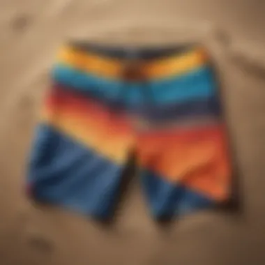 A vibrant collection of top-rated board shorts displayed on a sandy beach.