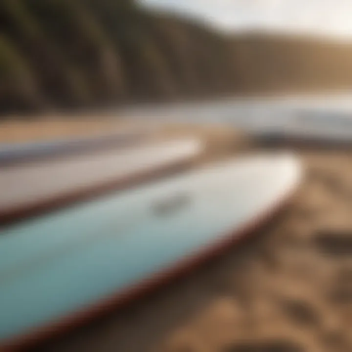 An array of surfboards ready for action on a sandy beach.