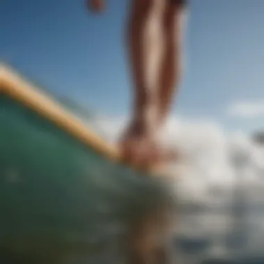 A close-up of a surfer's foot on a surfboard, showcasing technique and balance.