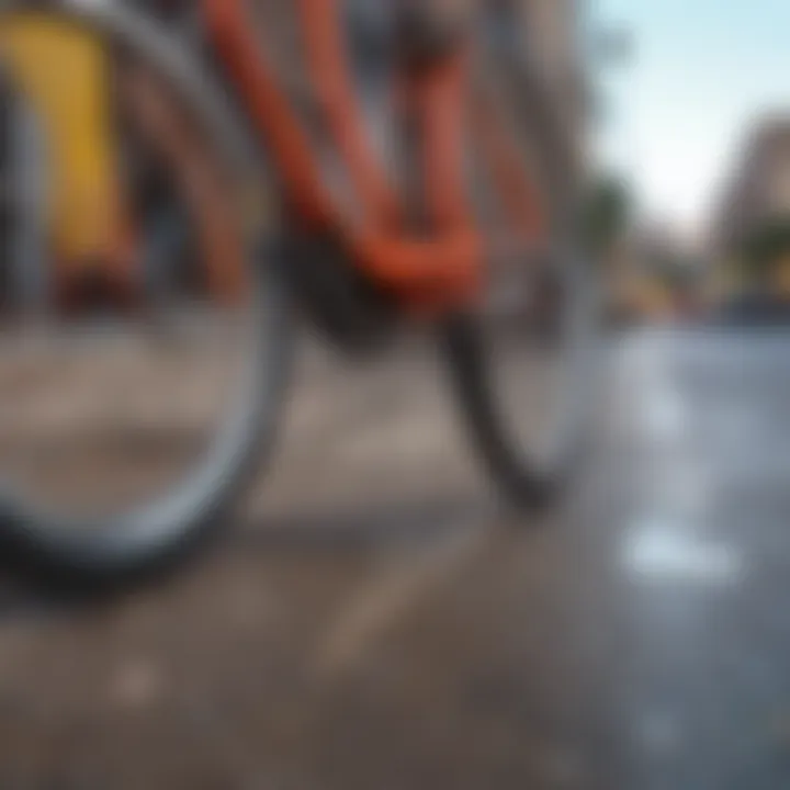 Close-up of a bicycle wheel on a vibrant city street