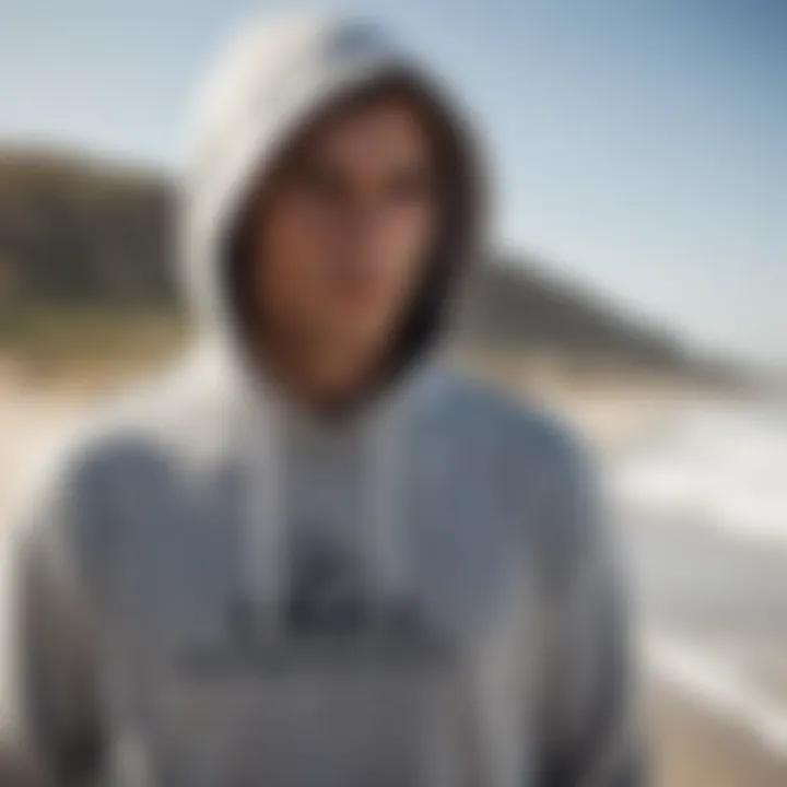 An athlete wearing a Quiksilver hoodie while engaged in extreme sports on the beach