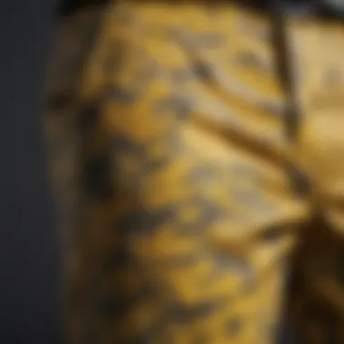 Close-up of yellow camo pants highlighting the fabric texture and patterns suitable for outdoor activities