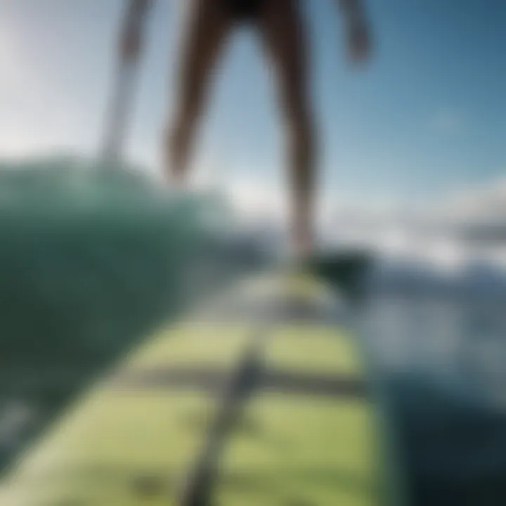 Close-up of paddleboard and wave interaction