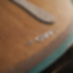 A close-up view of a Tomo surfboard showcasing its unique design and craftsmanship