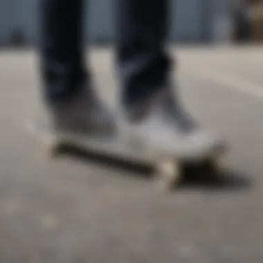 Close-up of grey low vans on a skateboard