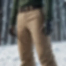 Stylish khaki snow pants on a snowy backdrop