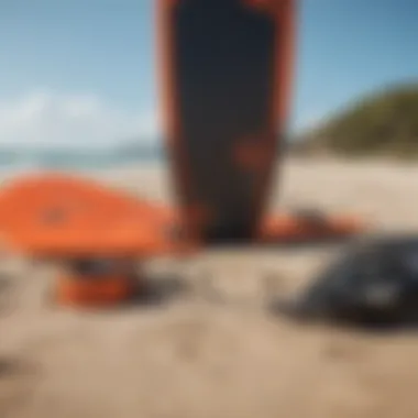 Kitesurfing equipment laid out on the beach