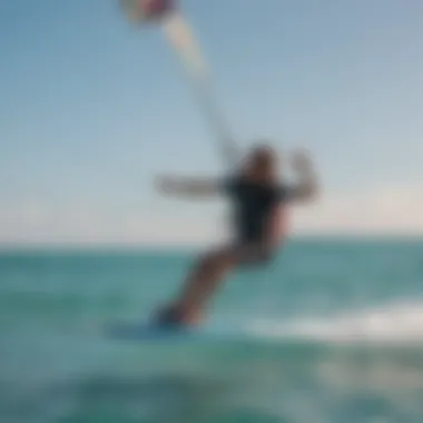 An instructor guiding a student during a kite surfing lesson in clear blue waters.