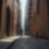 A striking contrast between urban skyscrapers and a lone skateboarder in an alley