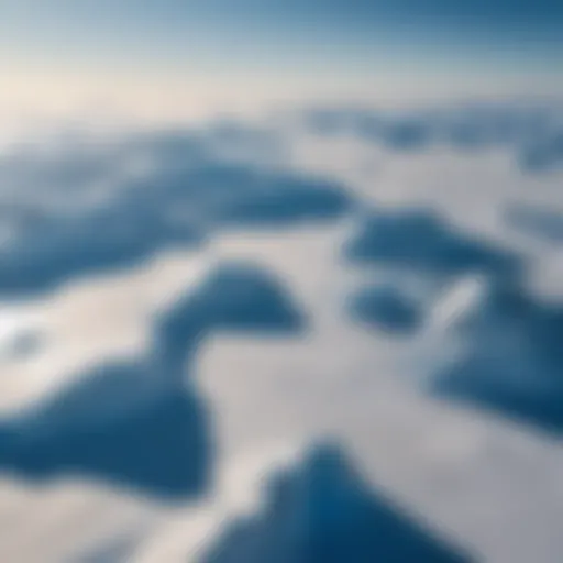 A breathtaking aerial view of the South Pole landscape, showcasing endless ice and snow under a brilliant blue sky.