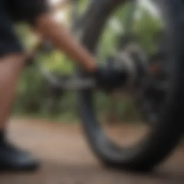 A cyclist inspecting tire pressure on a Pedego bike