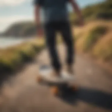 A rider executing smooth turns on a pintail skateboard along a coastal path