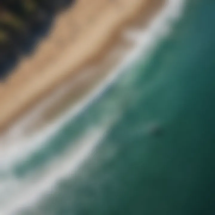 An aerial shot of the iconic Malibu surf spot with clear blue waters