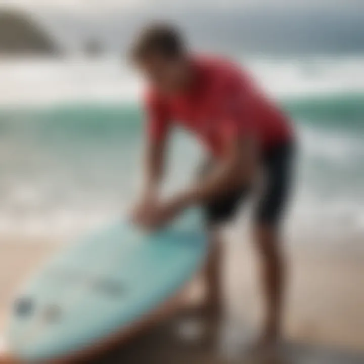 A surfer maintaining their surfboard, illustrating the care and upkeep needed for longevity.