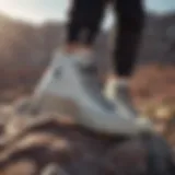 Close-up of Converse Star Hike sneakers on rocky terrain