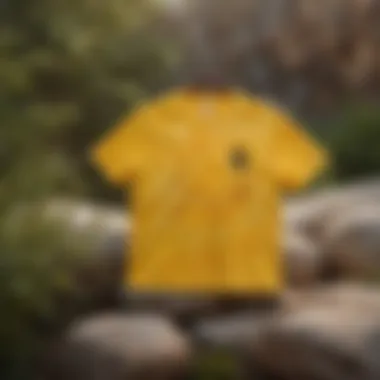 Vibrant Yellow Tie-Dye in Nature A vibrant yellow tie-dye shirt displayed against a rocky outdoor backdrop.