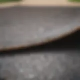 Close-up of textured grip tape on a skateboard deck