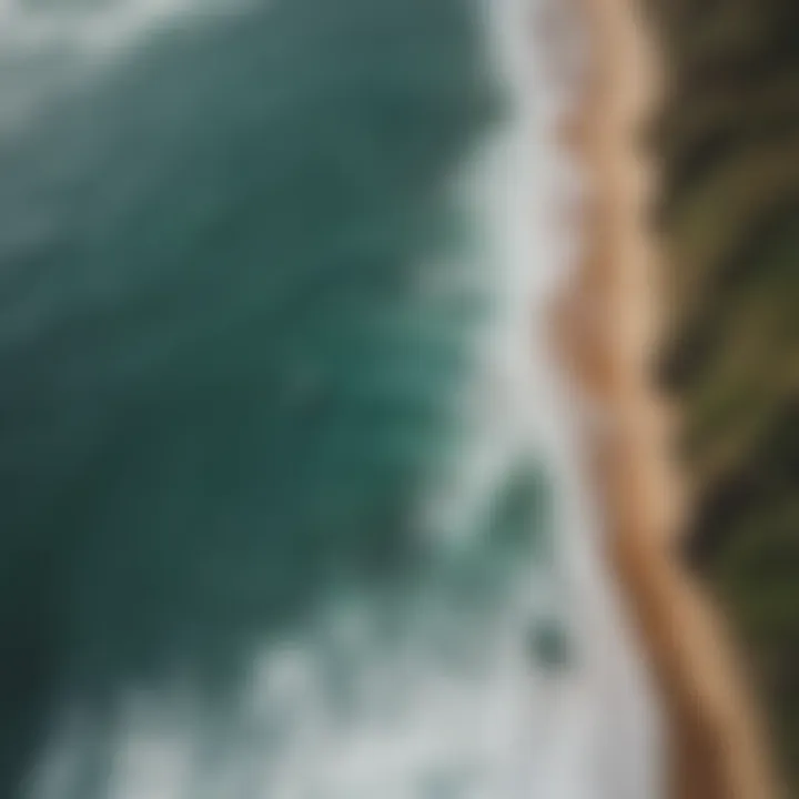 Aerial view of the Great Ocean Road with surfers in the water