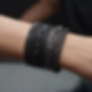 Close-up of intricate design elements in black love bracelets