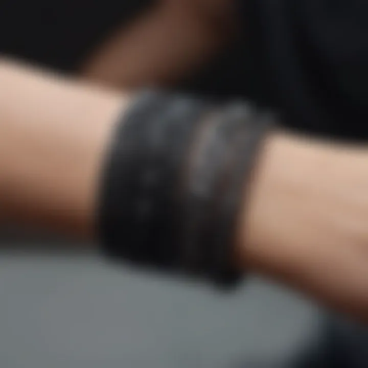 Close-up of intricate design elements in black love bracelets