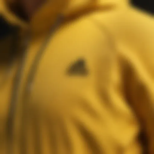 Close-up of the fabric texture of the yellow Adidas hoodie