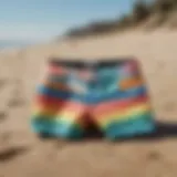 Vans swim trunks in vibrant colors displayed on sandy beach